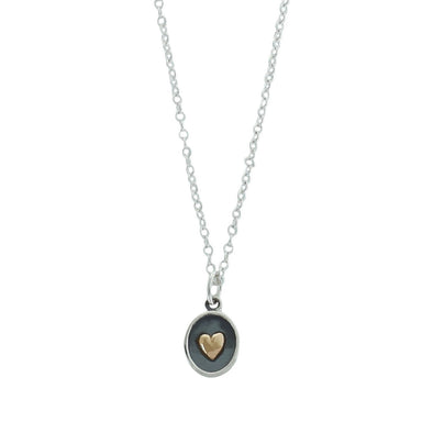 Bronze heart on sterling silver oval necklace on white background
