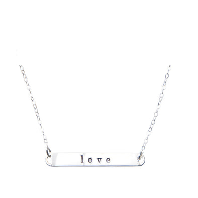 Sterling Silver hand-stamped 'love' necklace.