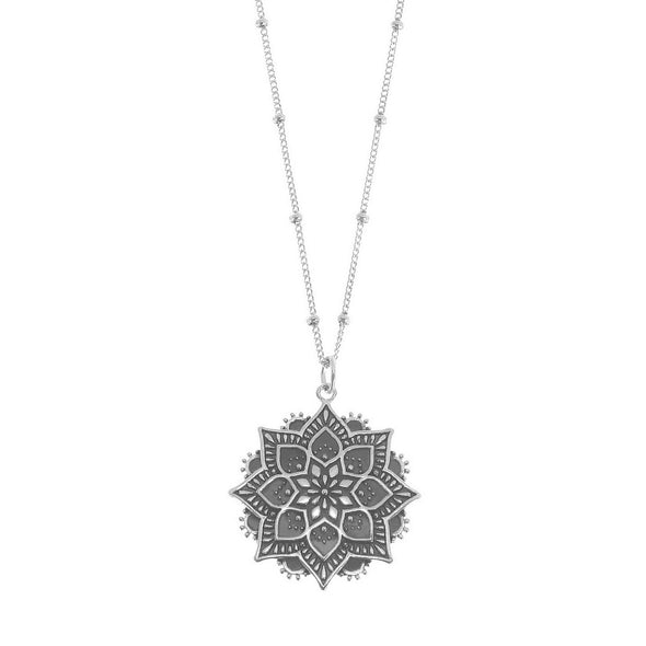 Sterling silver mandala necklace on white background