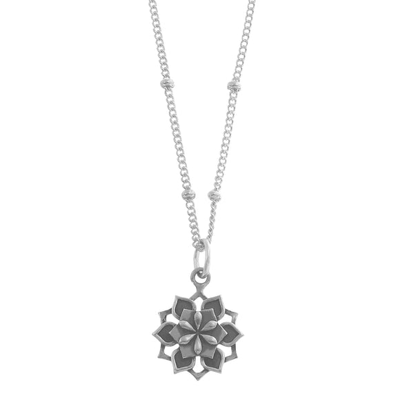 Small Sterling Silver Lotus flower necklace on white background