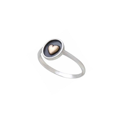 Sterling silver Ring with bronze heart on white background