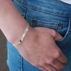 Sterling silver hand-stamped bracelet - choose love on wrist