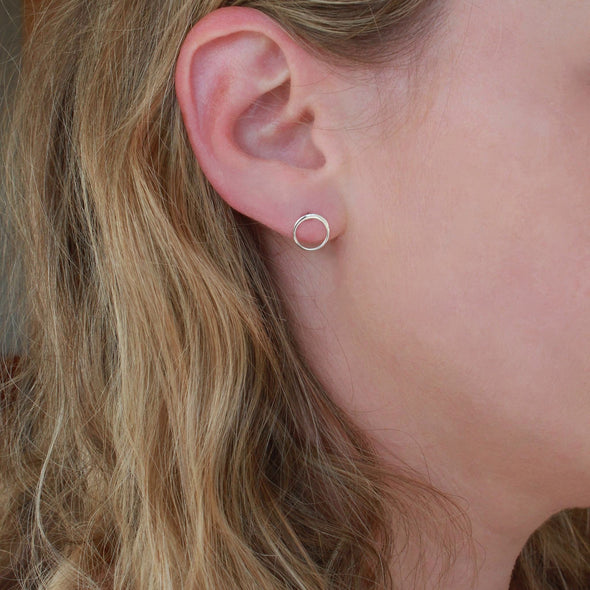 Sterling Silver Circle stud earrings on earlobe