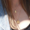 Gold Owl pendant necklace layered with angel necklace