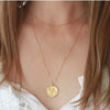 Gold chain choker layered with Gold Owl pendant necklace on neck