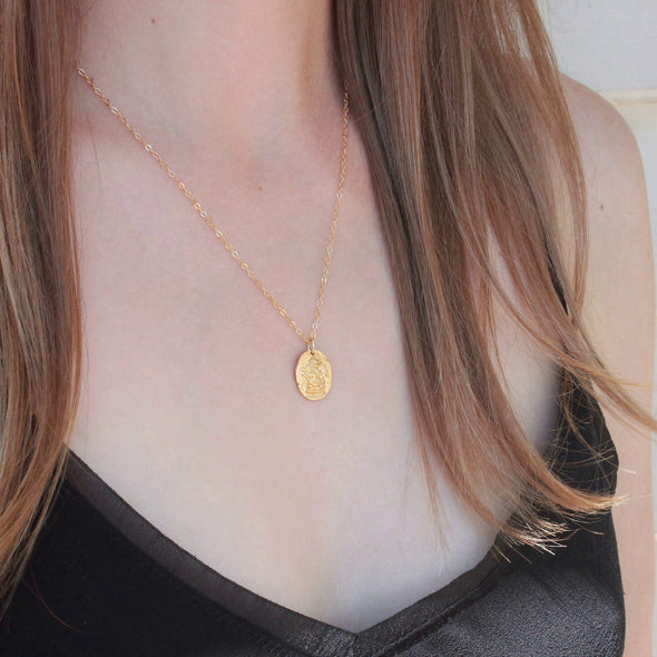 Gold Ganesh pendant necklace on model