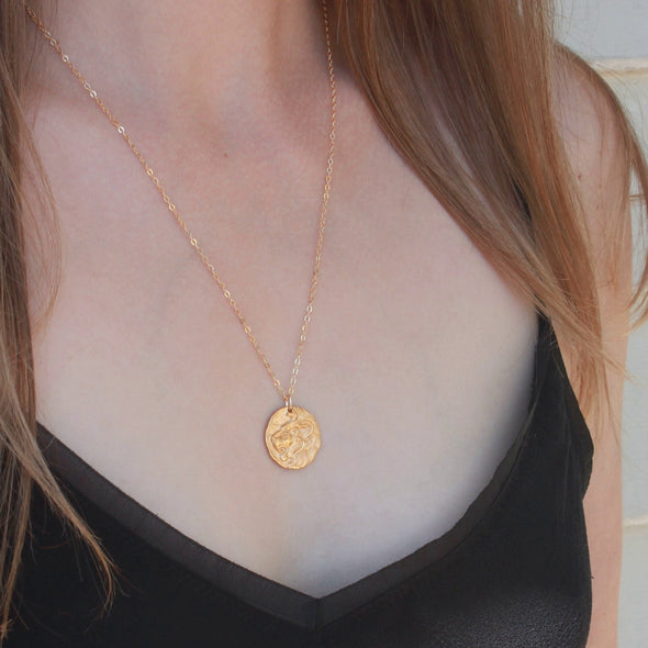 Gold lion pendant necklace