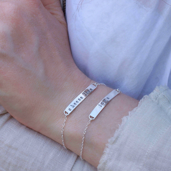 Sterling silver hand-stamped bracelet s- choose love & love on wrist.
