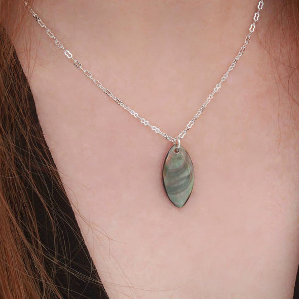 Paua & Black Mother of Pearl double-sided necklace on neck.