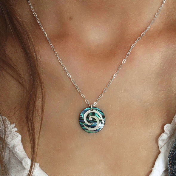 Paua Koru Necklace on the neck