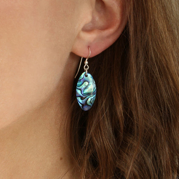 Paua Oval Earrings on ear