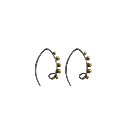 Bronze spheres on hoop earring on white background
