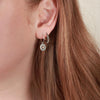 Bronze heart hoop earrings on model