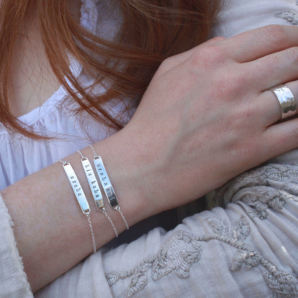 Three hand-stamped Sterling silver message bracelets - aroha, aroha nui, kia kaha