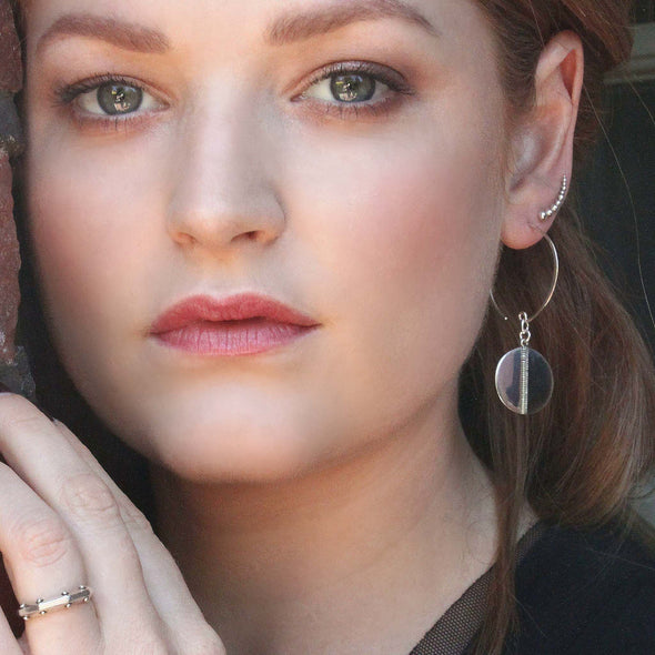 Sterling silver ring and earrings on model