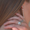 Sterling silver stud pearl earring side view on model